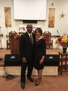 Pastor-and-carolyn-by-pulpit-scaled